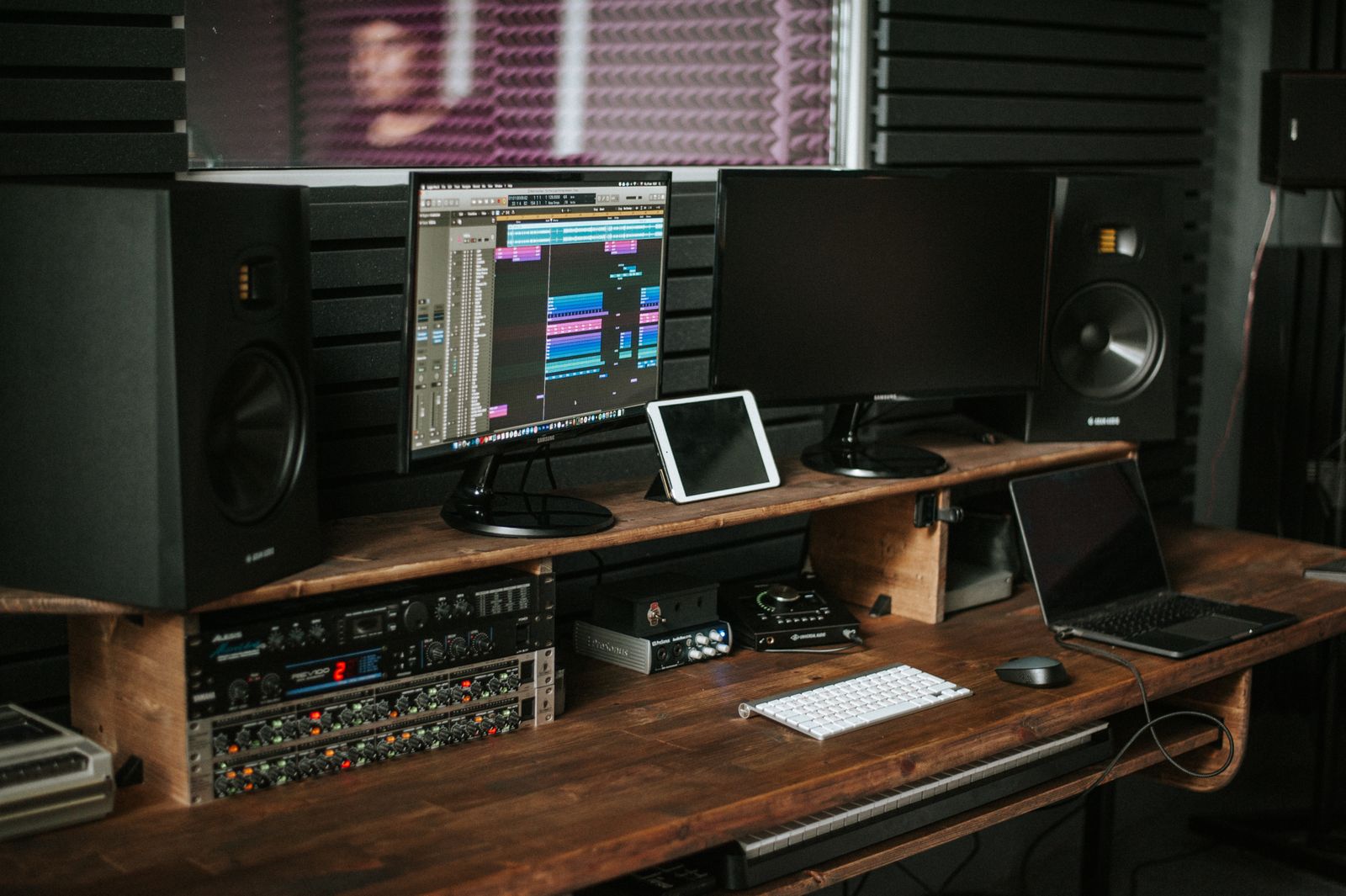 Speakers and computer displays on a recording desk