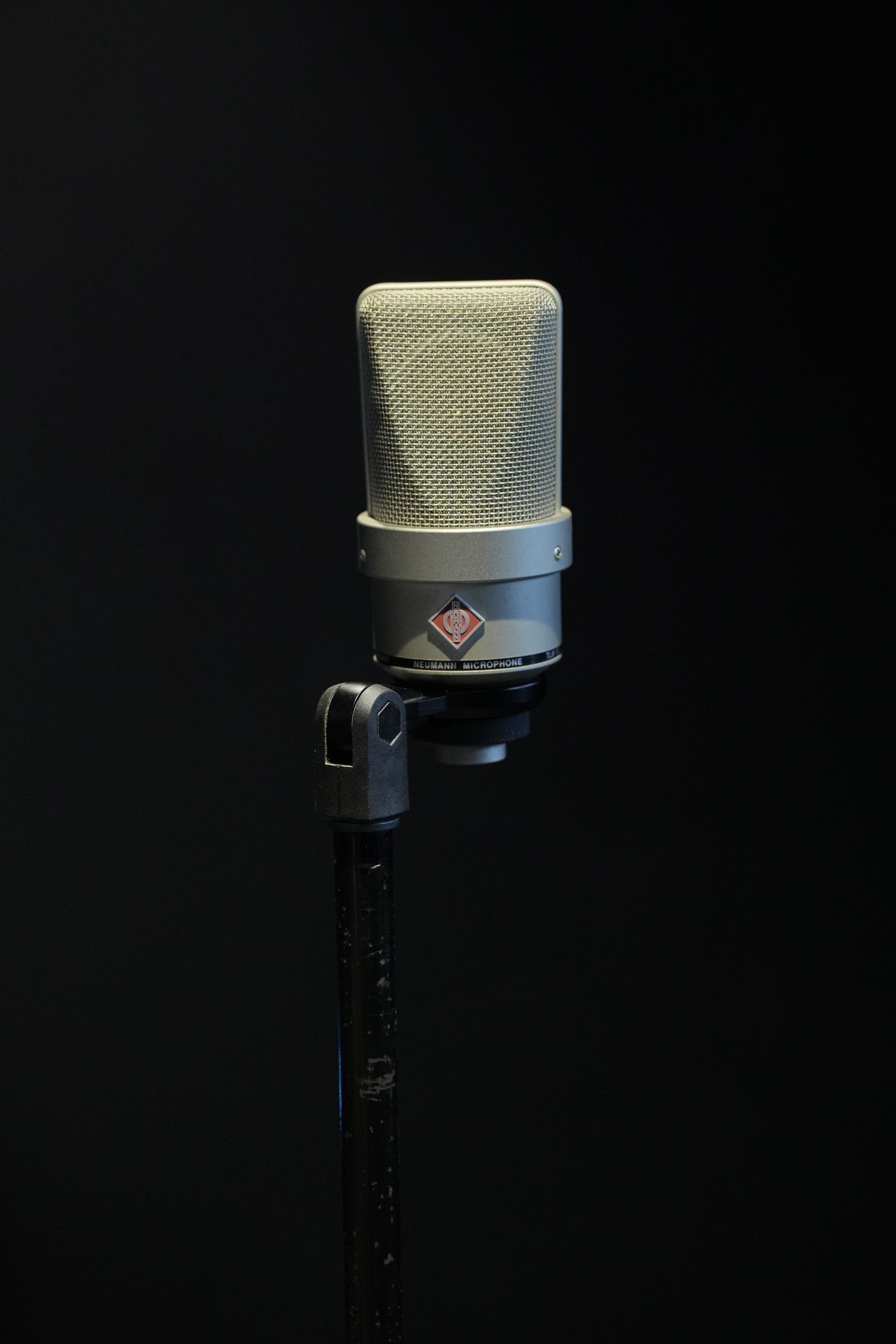 Studio microphone against a dark background