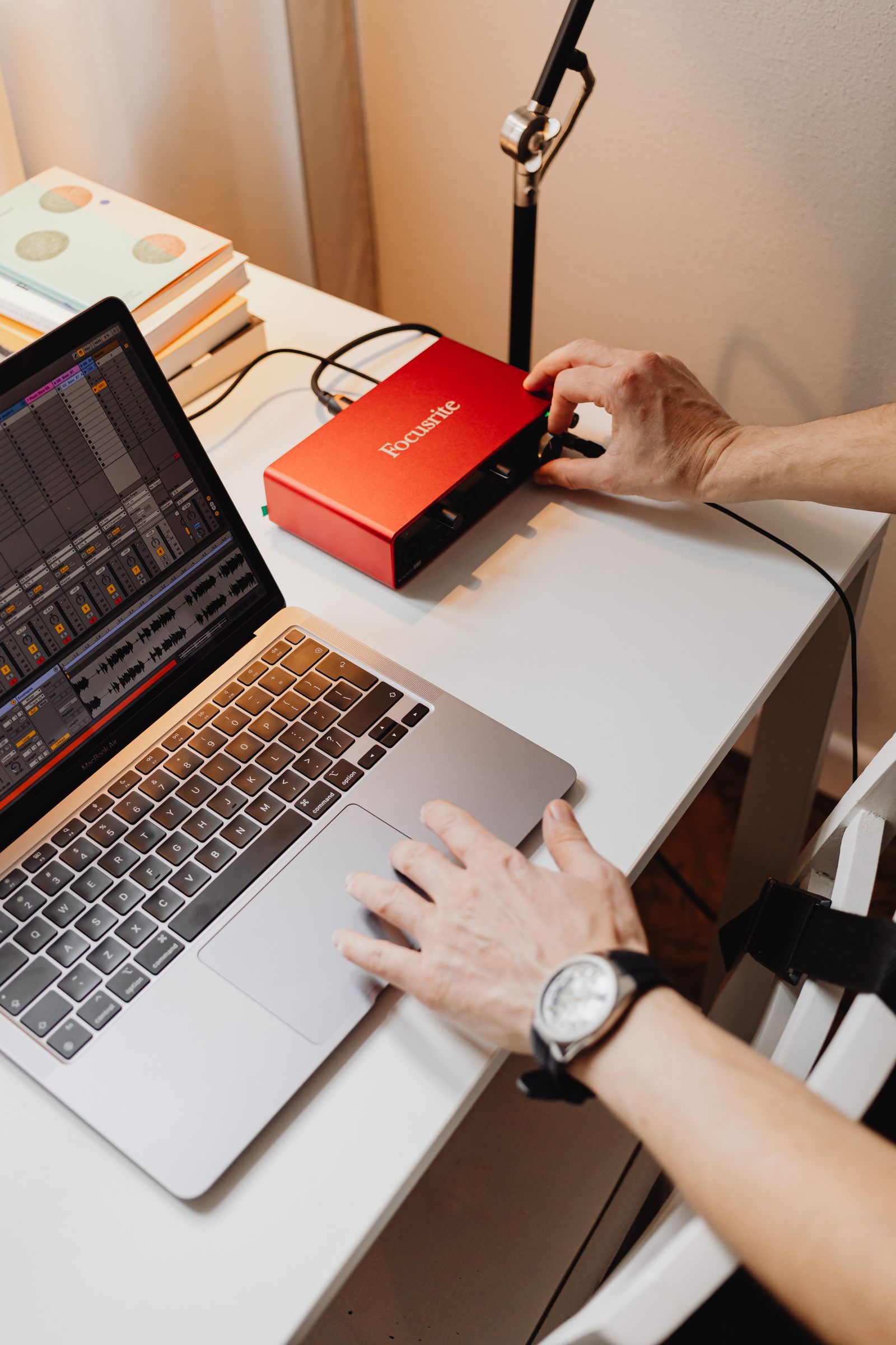 Laptop and connected audio interface on a recording desk