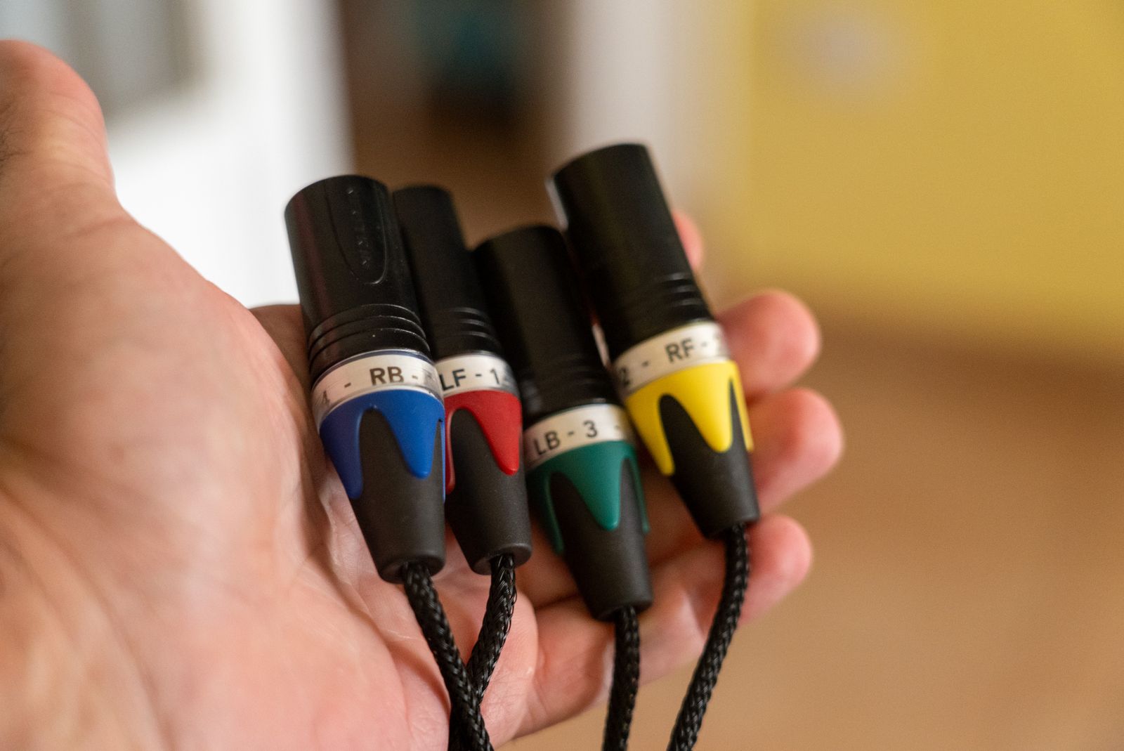 Several XLR cable connectors held together