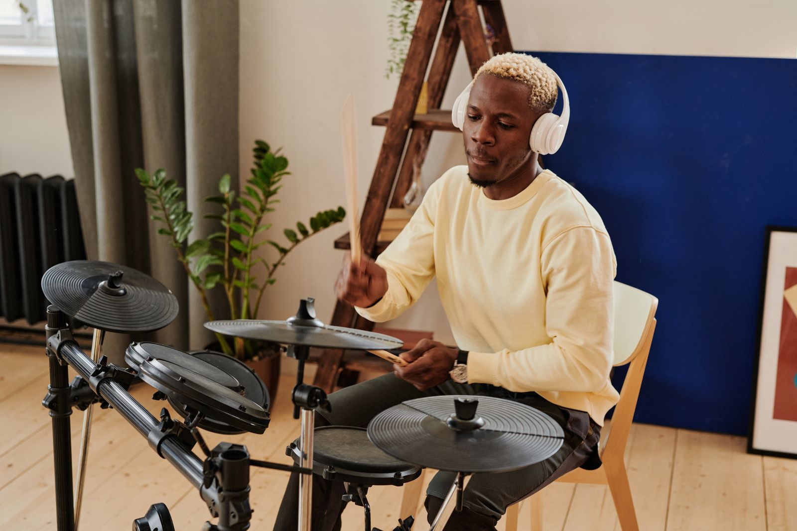 Drummer practicing on an electronic drum kit