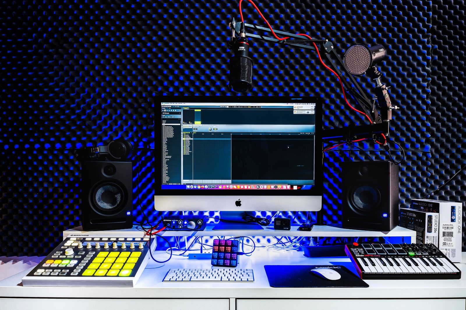 Computer and compact controllers on a recording desk