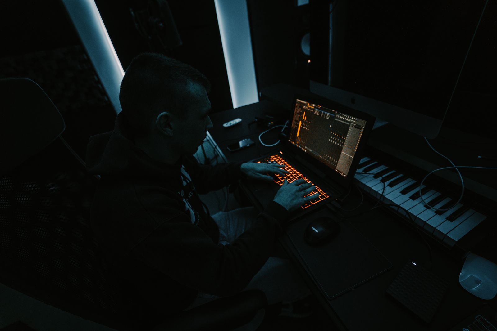 Musician reviewing a laptop music session